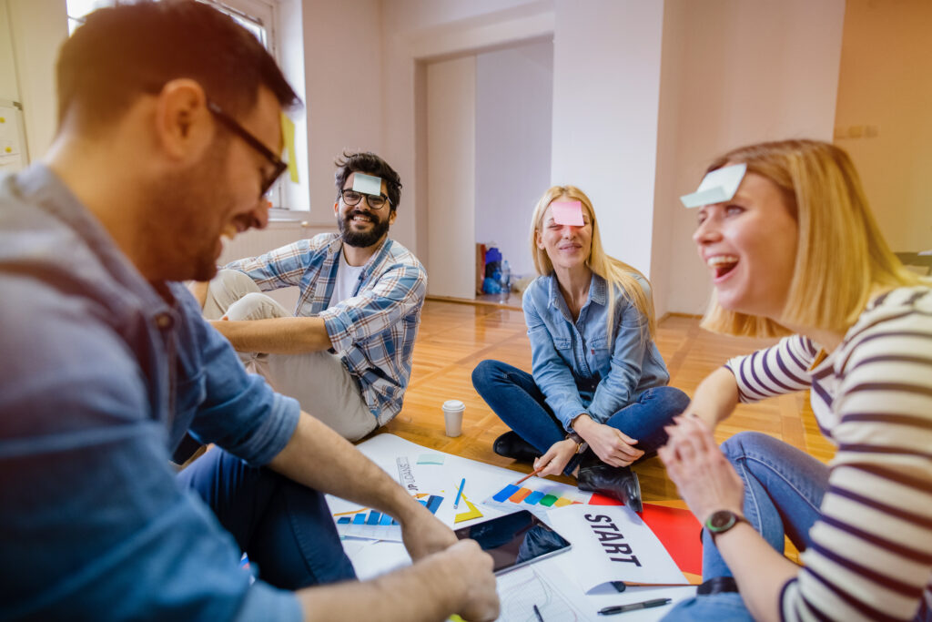 people sat around taking part in team building exercises