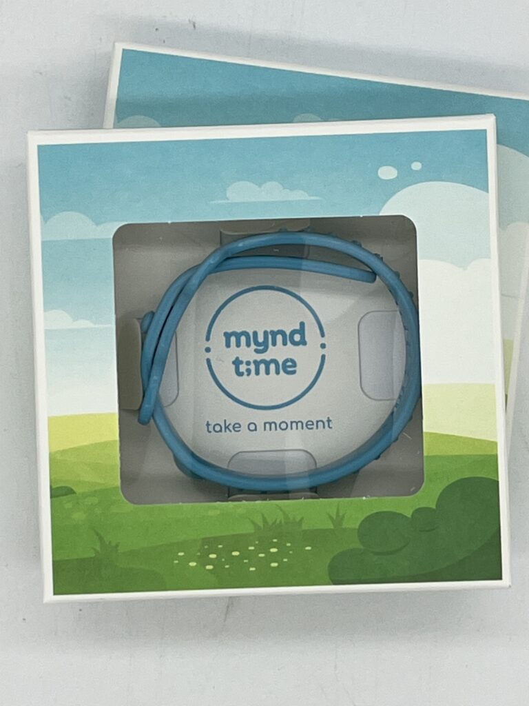 A digital watch strap in a pale blue sky patterned box with branding 'Myndtime' in the centre.