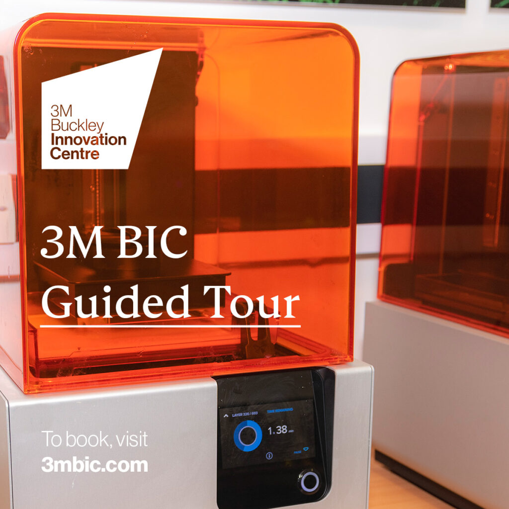 Orange 3D printer with white 3M Buckley Innovation Centre logo and text overlayed.